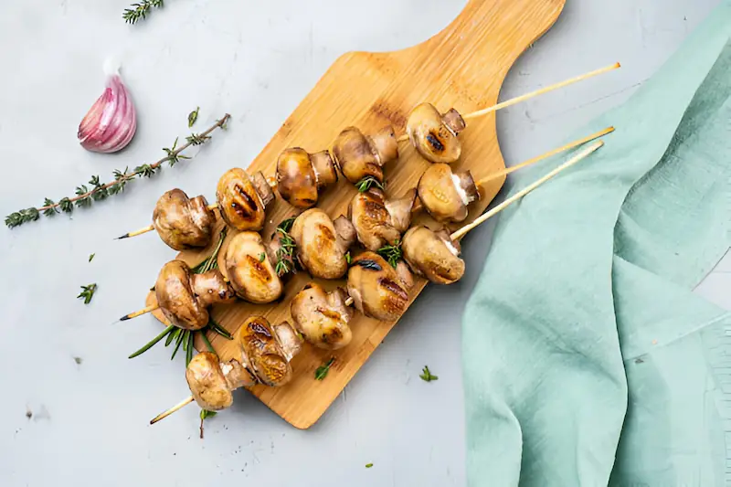 Grilled champignon skewers