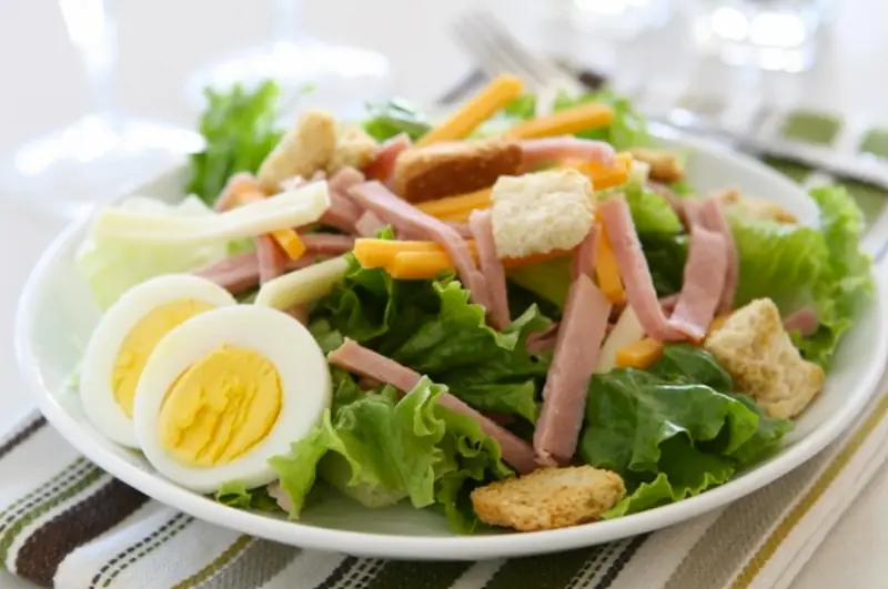 Salad with ham and two types of cheese